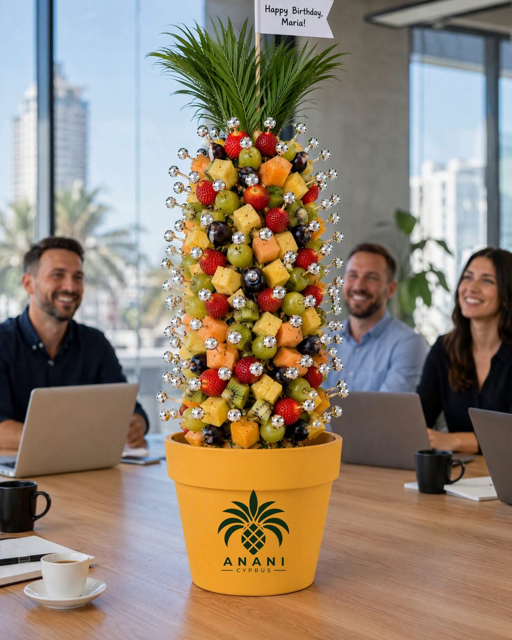 Solo tree on an office table with a birthday flag